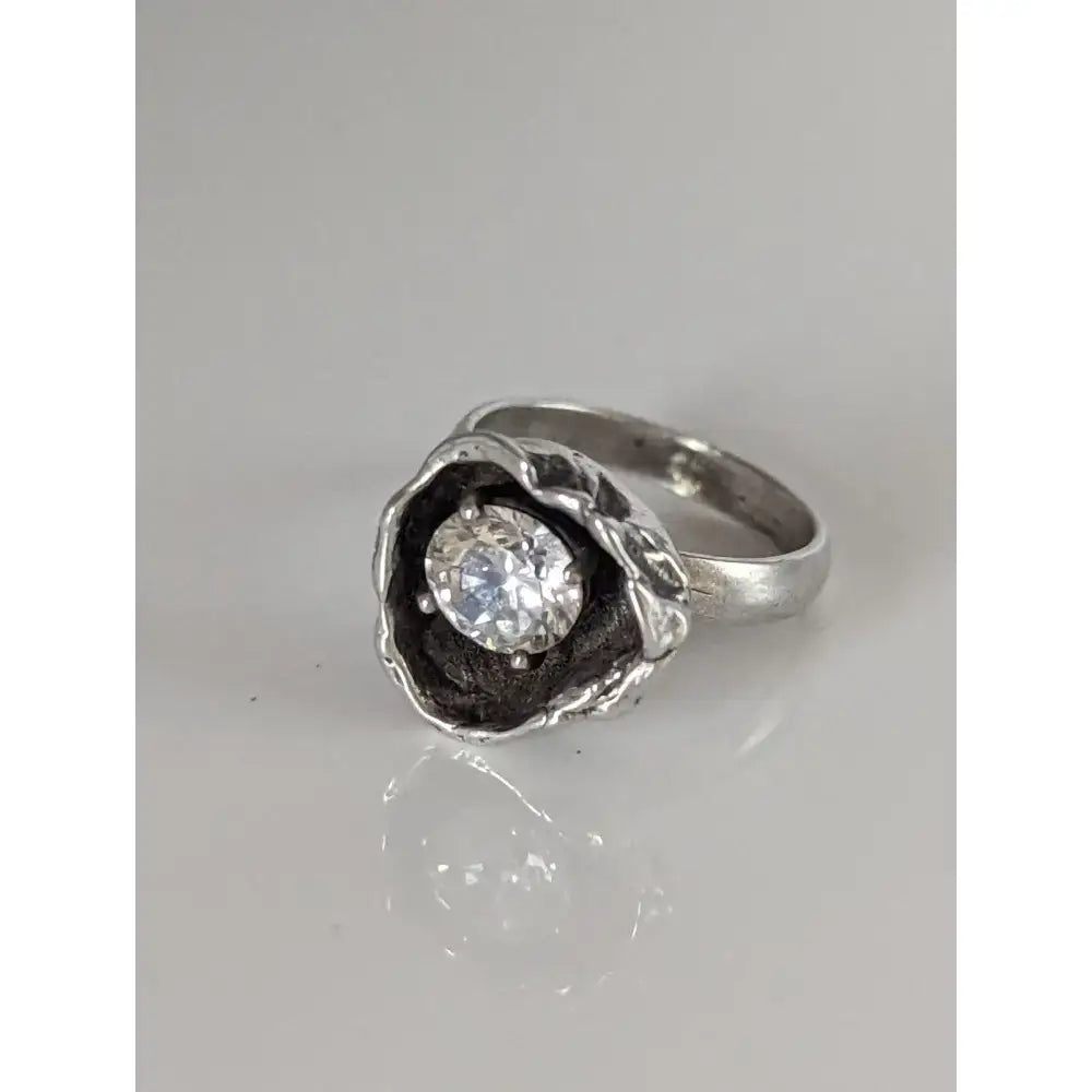 Silver steed large flower silver ring with textured organic setting holding round-cut clear zirconia gemstone equestrian jewelry