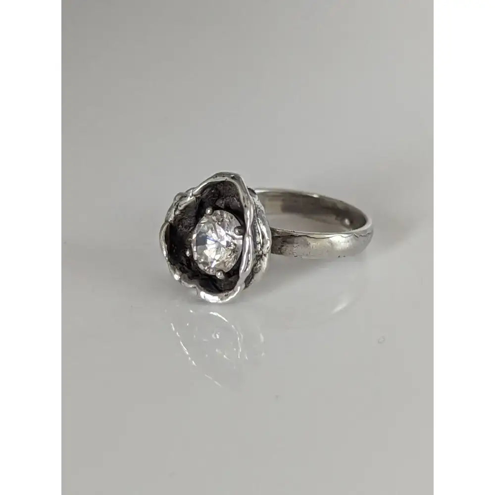 Silver steed large flower silver ring with handcrafted textured flower and clear round-cut zirconia gemstone in silver equestrian jewelry