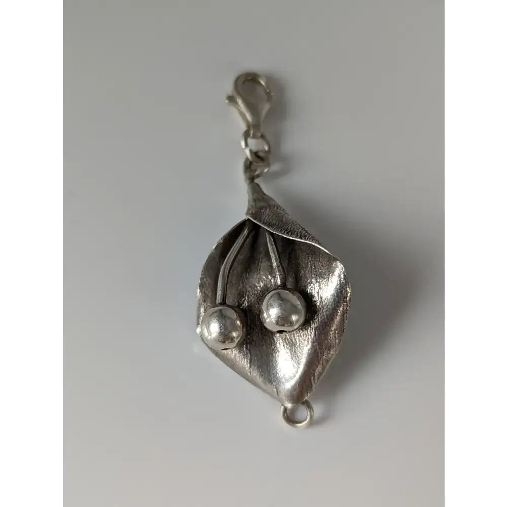 Silver steed leaf and berries silver charm featuring textured sterling silver leaf and two spherical beads with lobster clasp