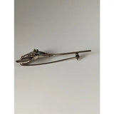 Silver steed leaf frog silver brooch in silver tone metal with abstract figure and textured flowing lines design