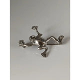 Silver steed leaping frog silver brooch with detailed limbs and textured skin perfect for equestrian jewelry fans