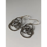 Silver steed linked rings dropped earrings with silver hoops, interlocking circles, and dark stone details