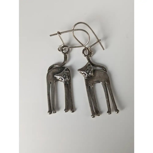 Silver steed long silver cat earrings with slender stylized design and simple wire hooks for cat lovers