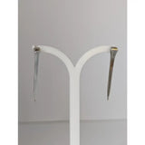 Silver steed long hoof nail stud earrings in silver with gold accent shaped like nail studs for stylish wear