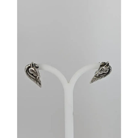 Silver steed horse head studs in silver with detailed facial features and flowing maned horse head design