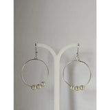 Silver steed loop sterling silver hoop earrings with three textured buds dangling from each circle