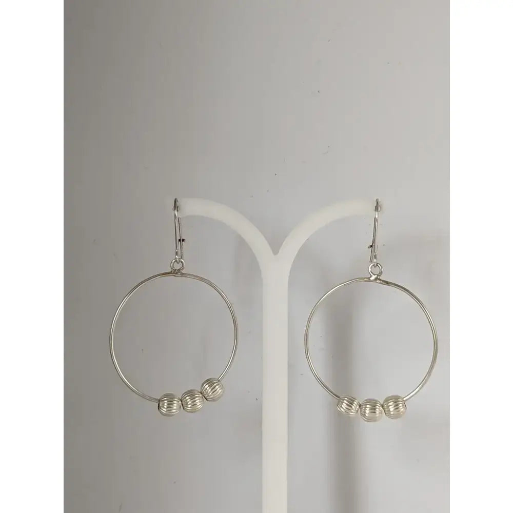 Silver steed loop sterling silver hoops with three textured buds dangling earrings in silver color