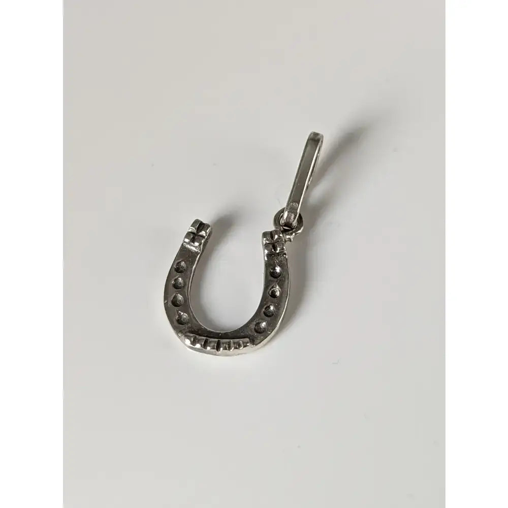 Silver steed lucky horseshoe silver pendant with small round studs and polished sterling silver bail for attachment