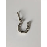 Silver steed lucky horseshoe silver pendant in sterling silver with small black dots along its curve