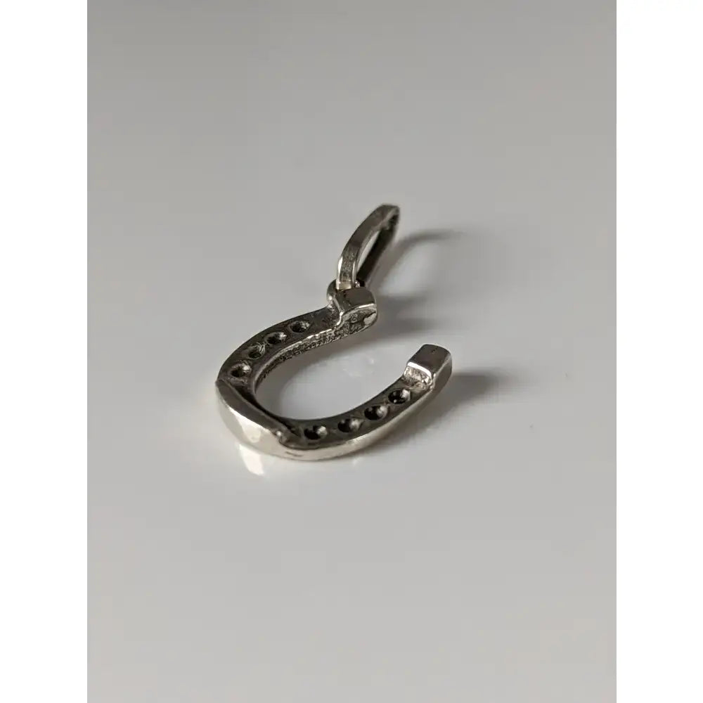 Silver steed lucky horseshoe silver pendant with small round studs in sterling silver and loop for attachment