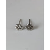 Silver steed margaret flower stud earrings with silver-toned five-petal flower design and textured finish