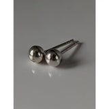 Silver steed medium ball stud earrings featuring minimalist silver polished spherical heads with slender posts