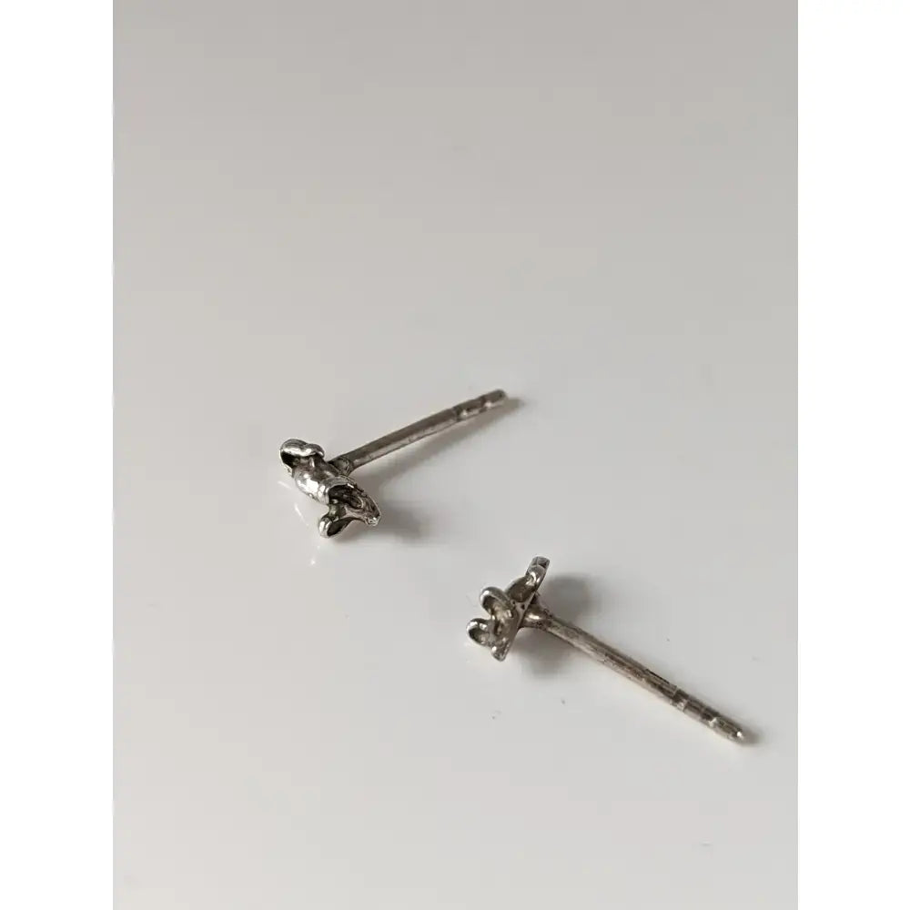 Silver steed mouse stud earrings with delicate silver flower design featuring tiny petals and subtle texture