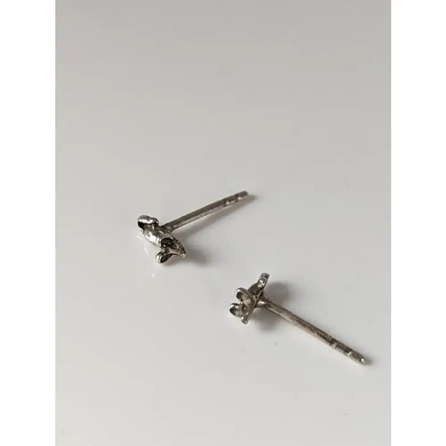 Silver steed mouse stud earrings with delicate silver flower design featuring tiny petals and subtle texture