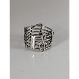 Silver steed music notes band is a silver ring featuring a treble clef and staff design perfect for equestrian jewelry fans