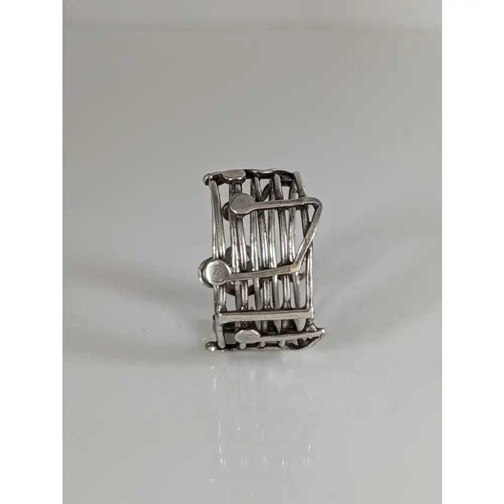 Silver steed music silver-toned metal toothpick holder with cage design and decorative music notes band details