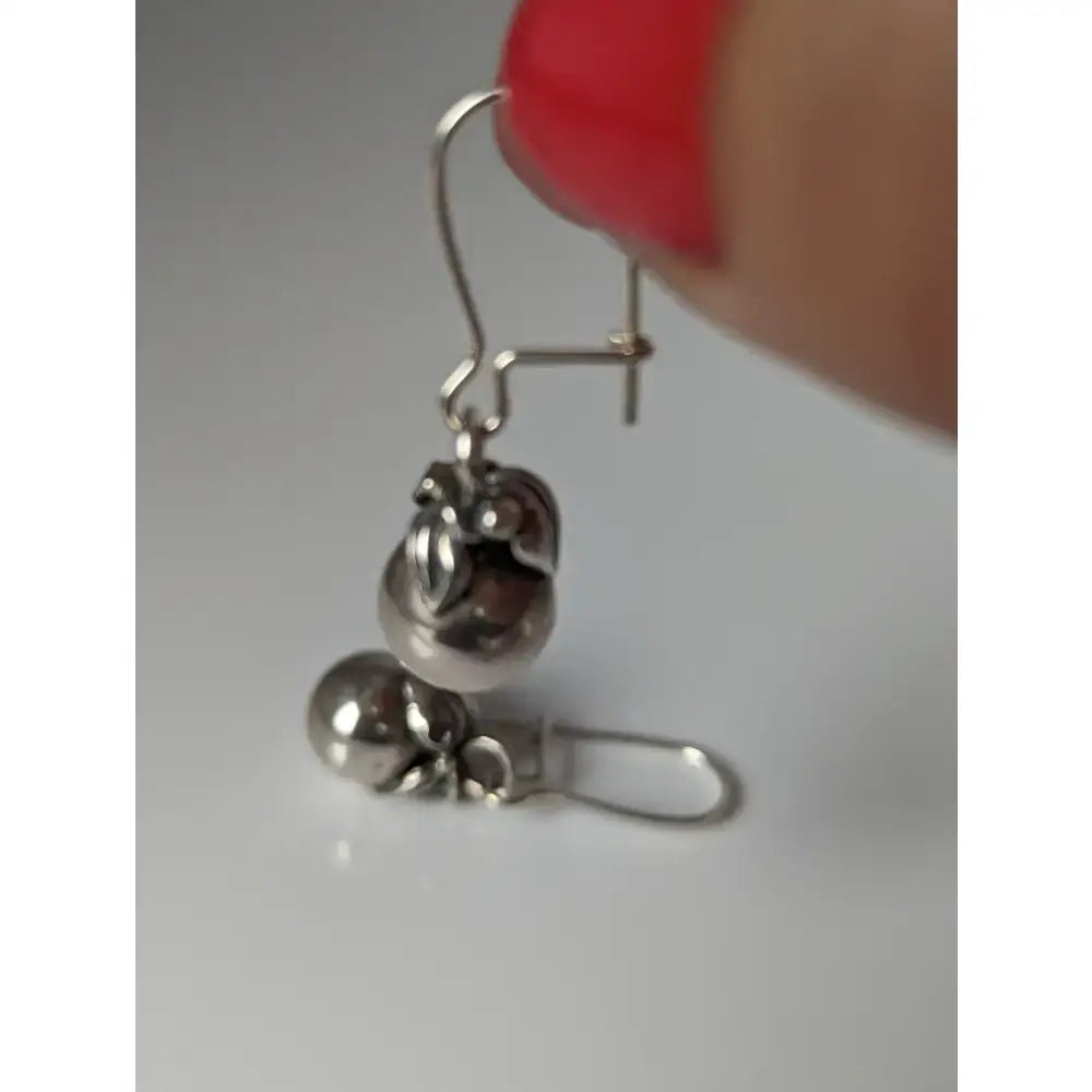 Silver steed oranges handcrafted silver skull-shaped oranges dropped earrings with polished finish and hook closures