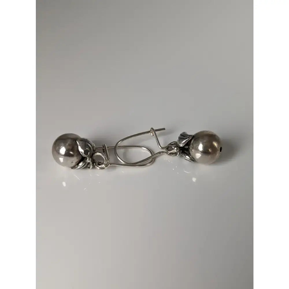 Silver steed oranges handcrafted silver dangle earrings with polished beads and intricate leaf metalwork design
