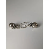 Silver steed oranges handcrafted silver dangle earrings with polished beads and intricate leaf metalwork design