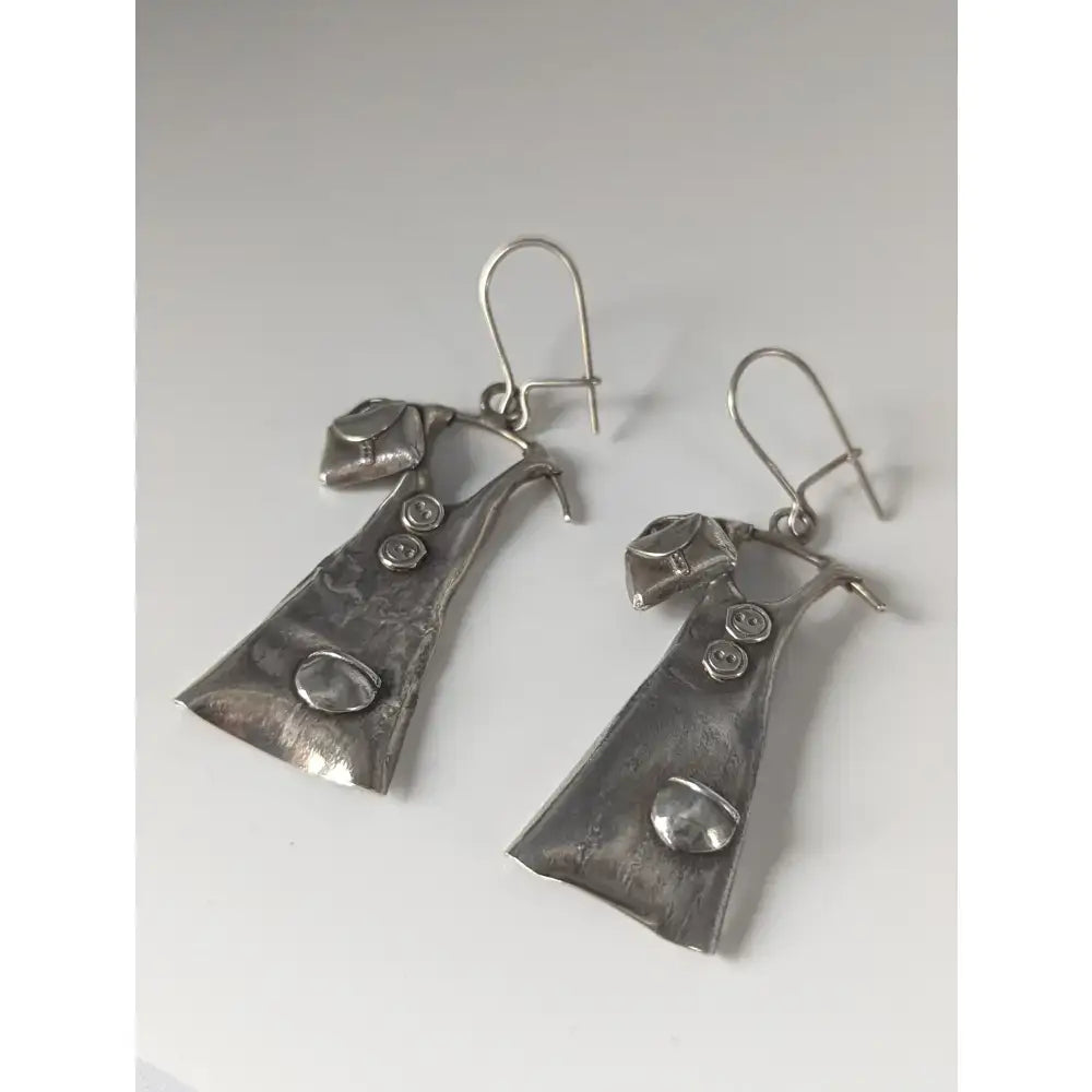 Silver steed outfit dropped earrings in silver shaped like miniature overalls with textured metal and inset details