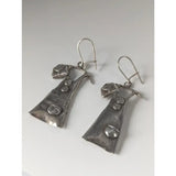 Silver steed outfit dropped earrings in silver shaped like miniature overalls with textured metal and inset details