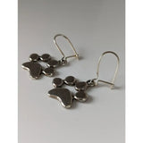 Silver steed paw print silver dropped earrings with modern abstract interconnected rounded shapes in polished silver
