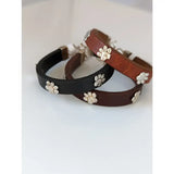 Three silver steed leather bracelets in black and brown with paw print leather charms for casual wear