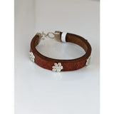 Silver steed leather bracelet with brown leather and silver paw print charms plus a matching metal clasp