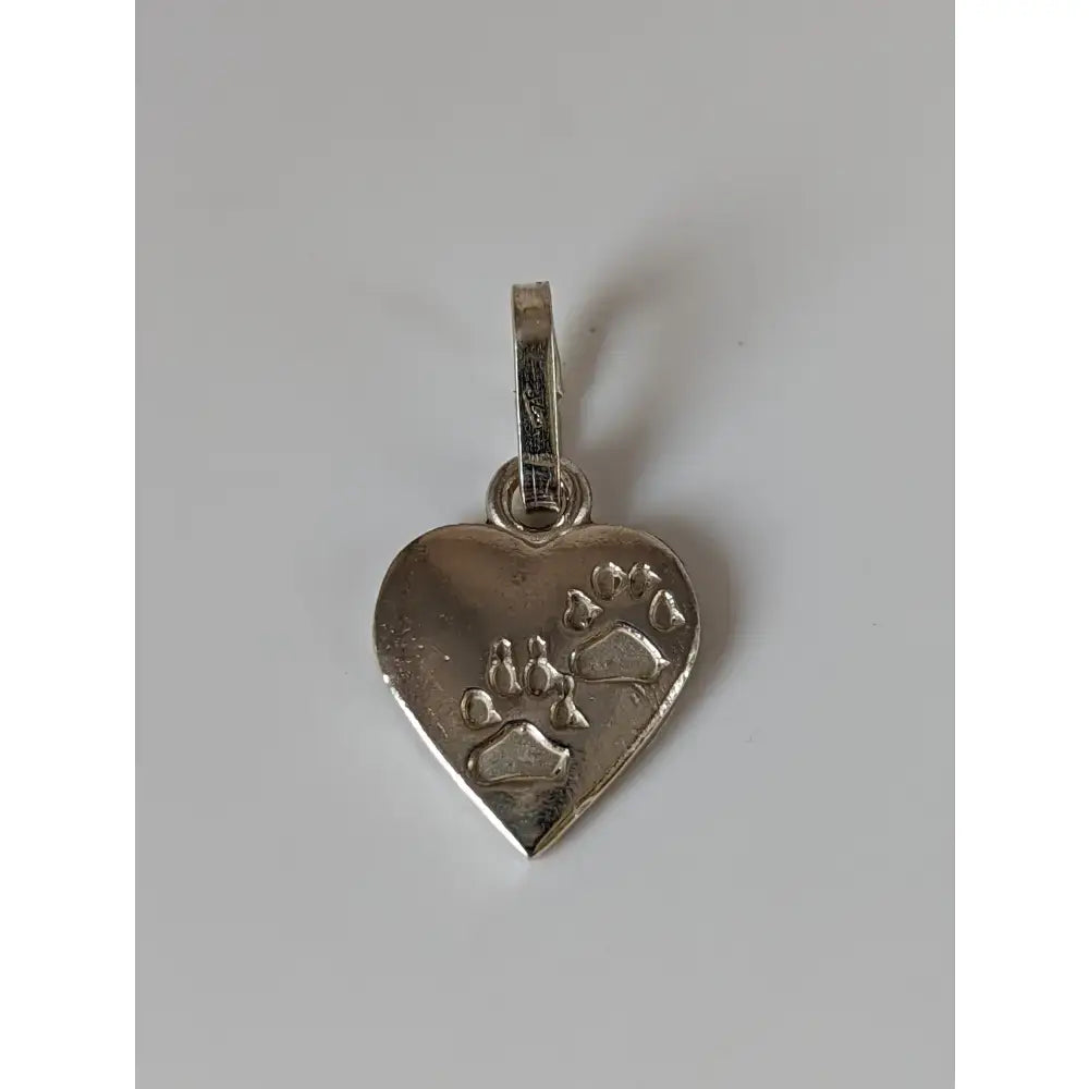 Silver steed heart silver pendant featuring a silver heart silver pendant with engraved paw prints