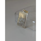 Silver steed paw silver pendant with rectangular shape and cut-out paw print tag design with small attachment loop