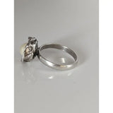 Silver steed pearl flower silver ring featuring a textured silver setting holding an off-white pearl perfect for equestrian jewelry