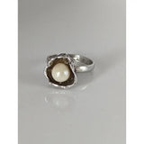 Silver steed pearl flower silver ring with a textured organic shell setting holding a creamy white pearl perfect for equestrian jewelry