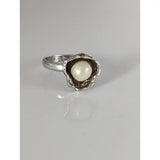 Silver steed pearl flower silver ring with a textured shell-like setting holding a lustrous white pearl for equestrian jewelry