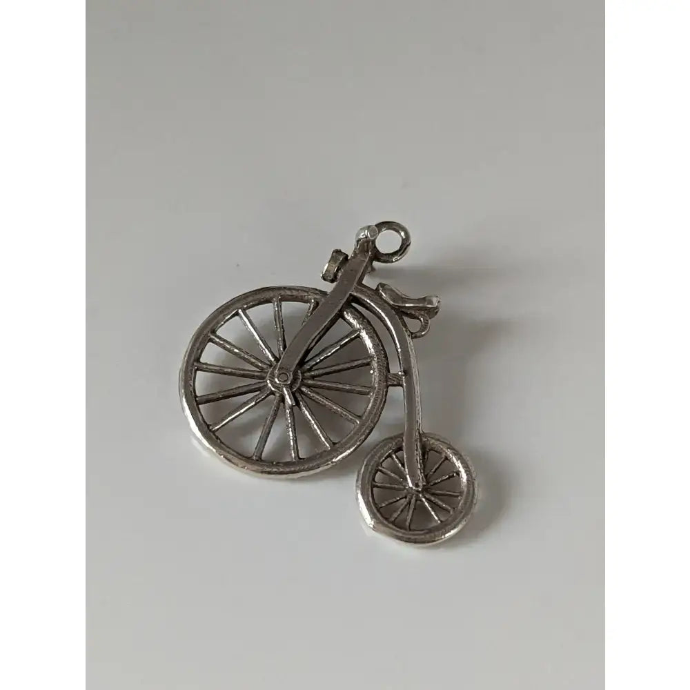 Silver steed penny vintage penny farthing bike silver pendant charm made of metal with a shiny finish