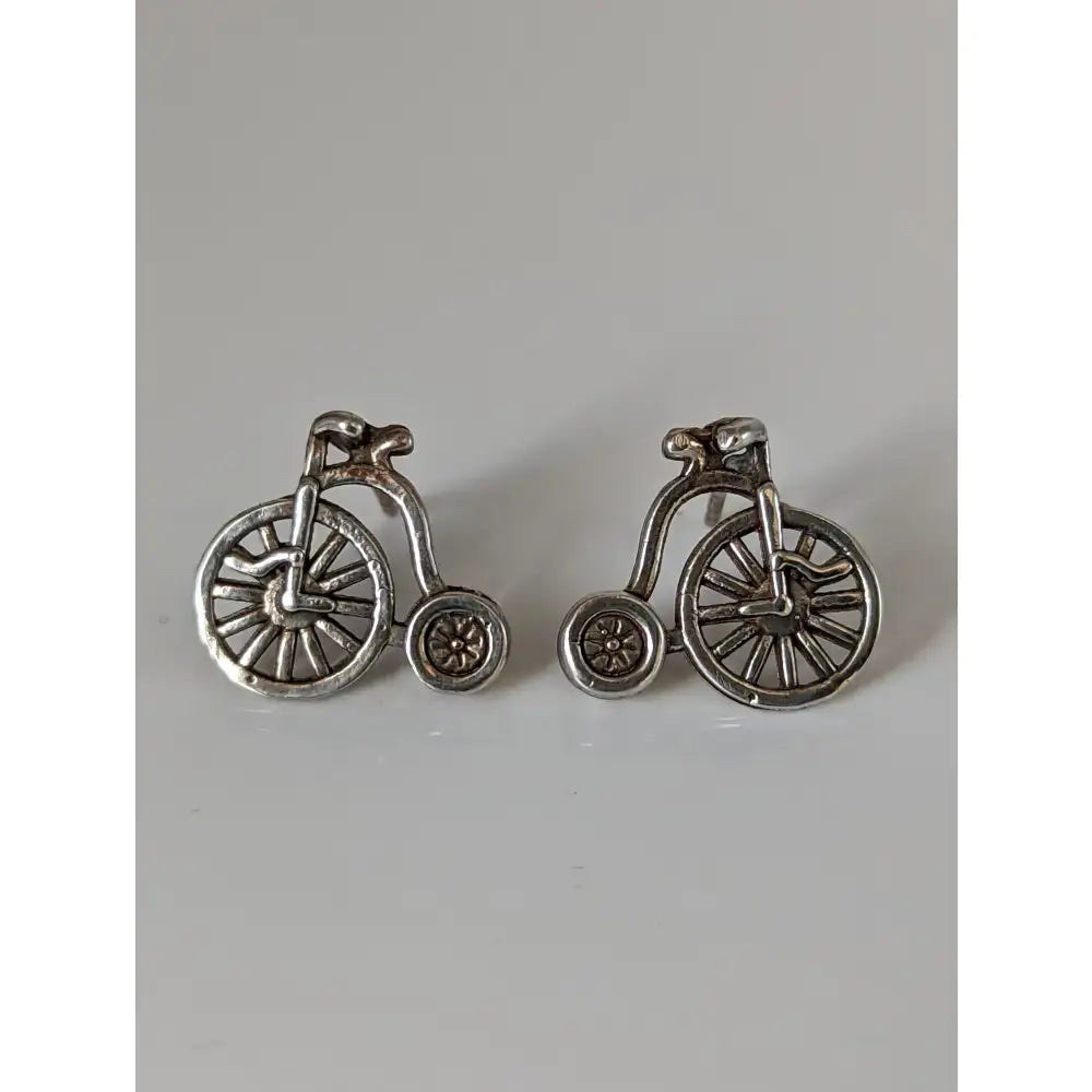Silver steed penny farthing bike stud earrings featuring intricate detailing on wheels and frame in silver tone
