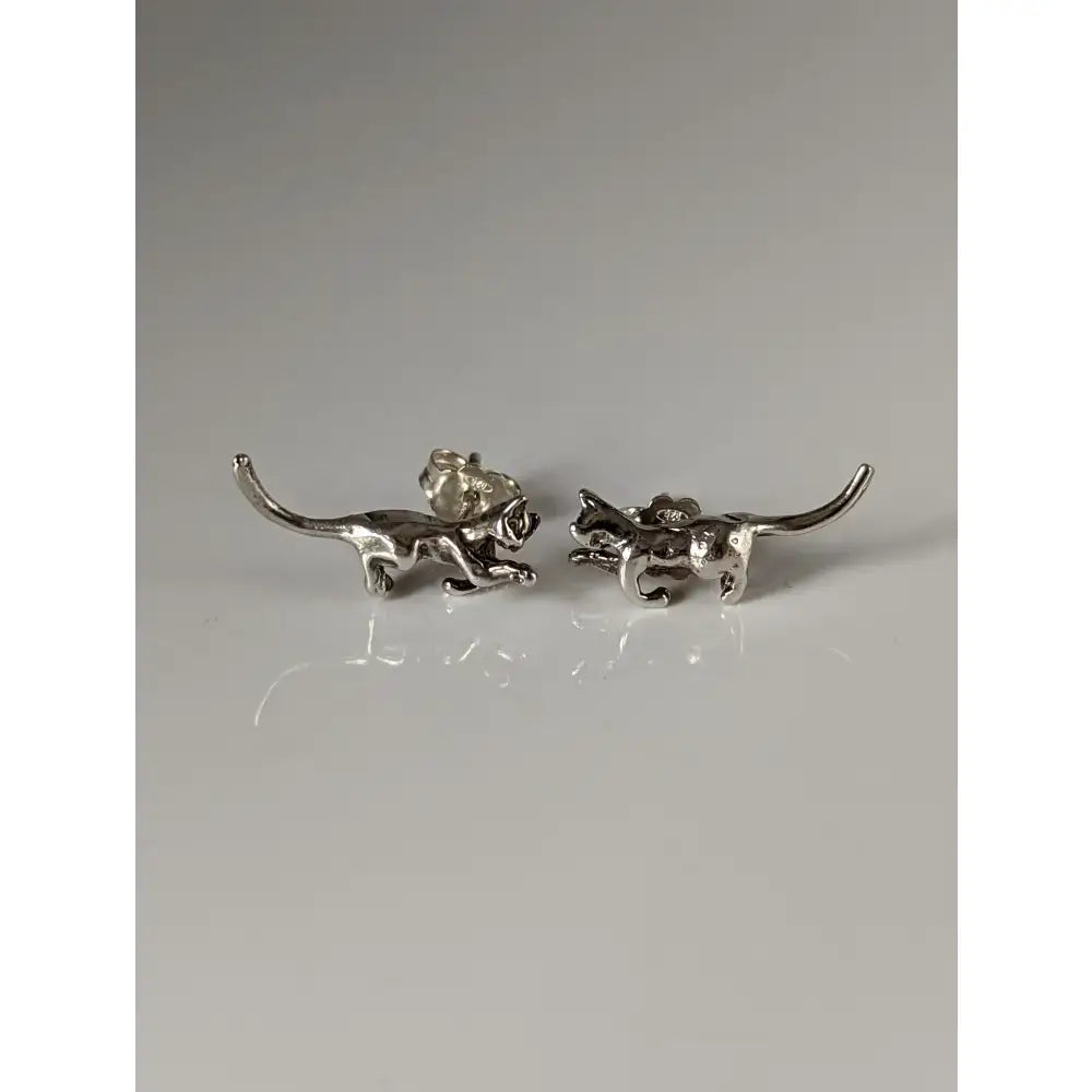Silver steed playful cat stud earrings with detailed articulated designs in silver metal for everyday wear