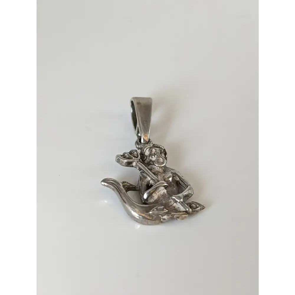 Silver steed poseidon sterling silver pendant featuring a detailed silver monkey holding a staff seated on a coiled serpent
