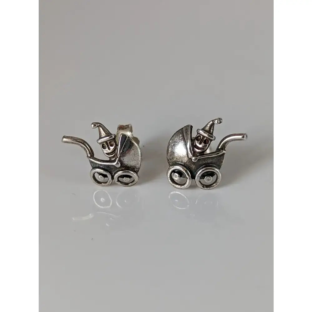 Silver steed pram sterling silver stud earrings with tiny smiling skeletons wearing pointed hats baby carriage design