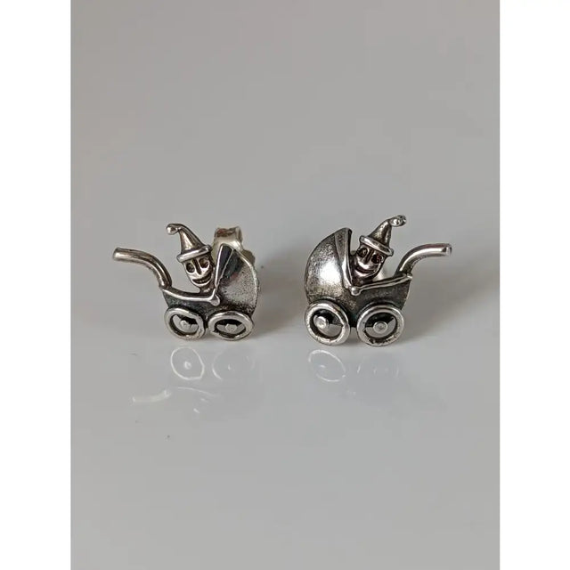 Silver steed pram sterling silver stud earrings with tiny smiling skeletons wearing pointed hats baby carriage design