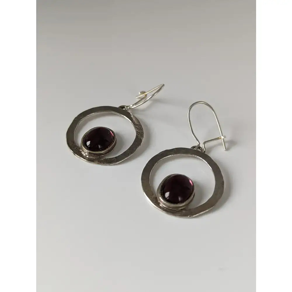 Silver steed purple crystal loop dropped silver hoop earrings with hammered texture and deep purple garnet stones