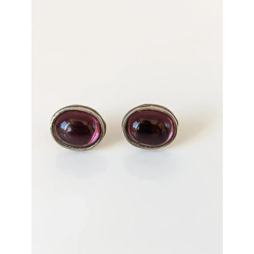 Silver steed purple ovals stud earrings with deep purple gemstones in handcrafted sterling silver textured frames