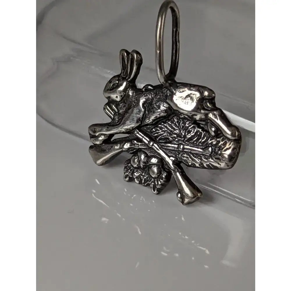 Silver steed rabbit hunting silver pendant with detailed 3d rabbit design crossed rifles and foliage in silver tone metal