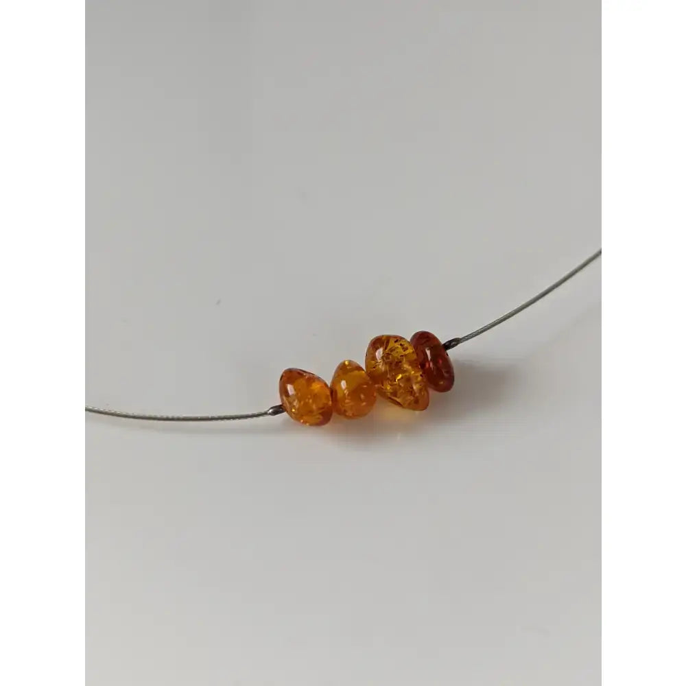 Silver steed real amber bead necklace with amber colored faceted genuine amber beads on thin wire