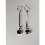 Silver steed red crystal dropped earrings featuring vibrant red gemstones in a simple silver drop design
