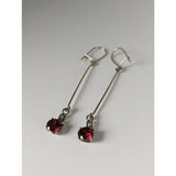 Silver steed red crystal dropped earrings with round faceted red gemstones in sleek silver drop setting