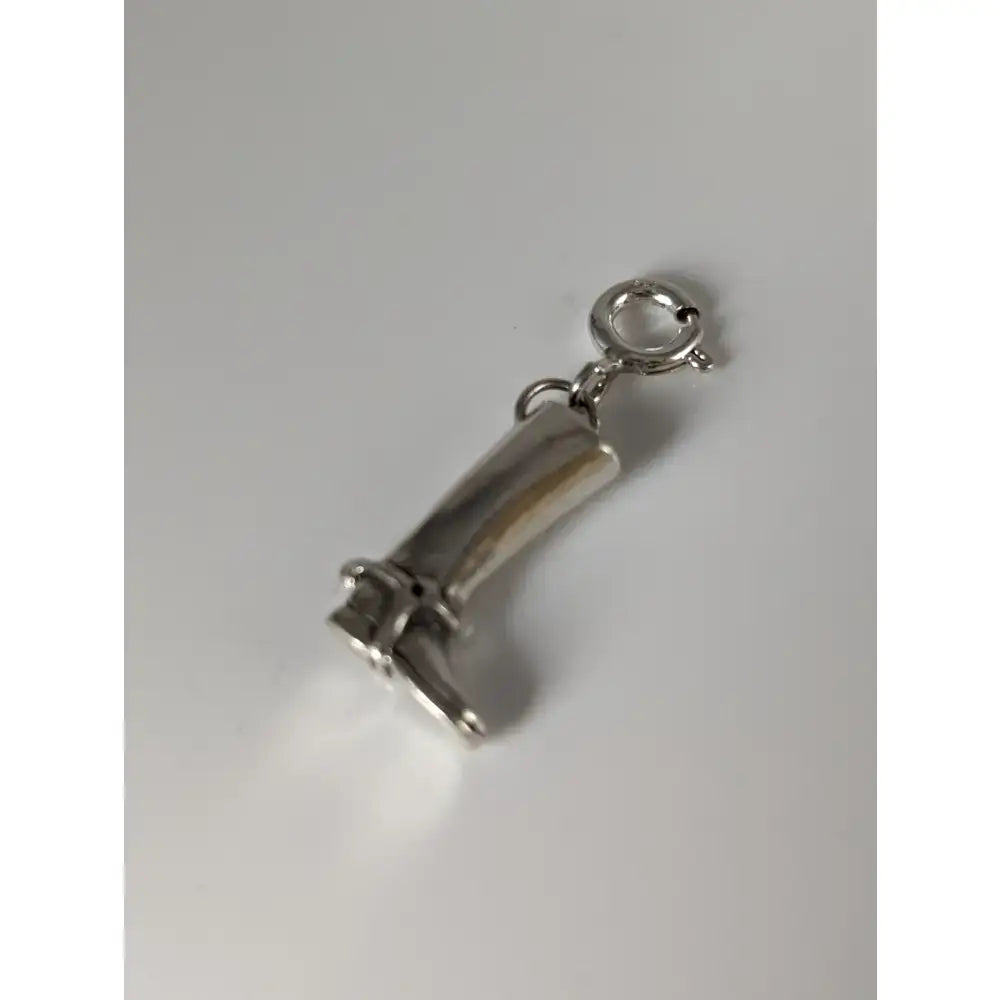 Silver steed riding boot silver charm made of polished silver with detailed stitching and miniature boot shape