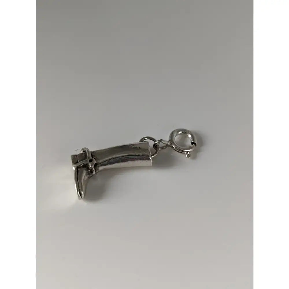 Silver charm shaped like a riding boot with buckle detail in silver steed riding boot silver design