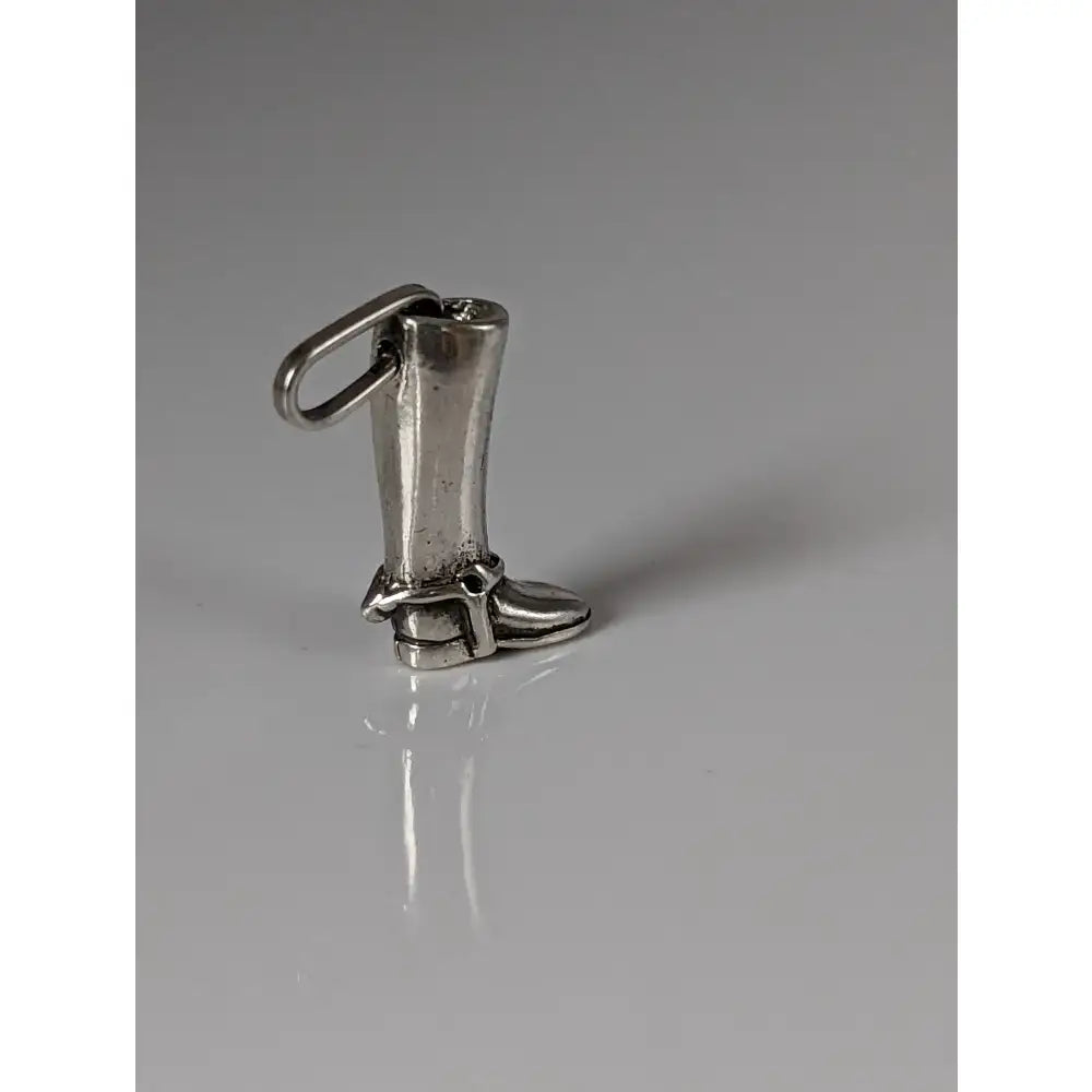 Silver steed riding boot pendant in silver-colored metal with a loop for attaching to a high polished chain