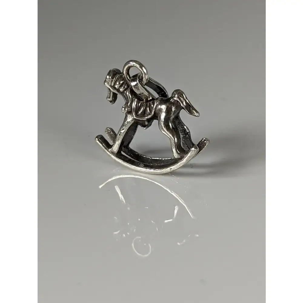 Silver steed rocking horse silver pendant charm with detailed craftsmanship and polished metallic finish for equestrian jewelry