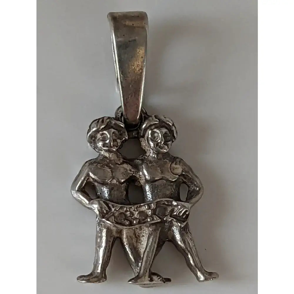 Silver steed romans twins silver pendant featuring a silver pendant with two intertwined classical figures gemini design